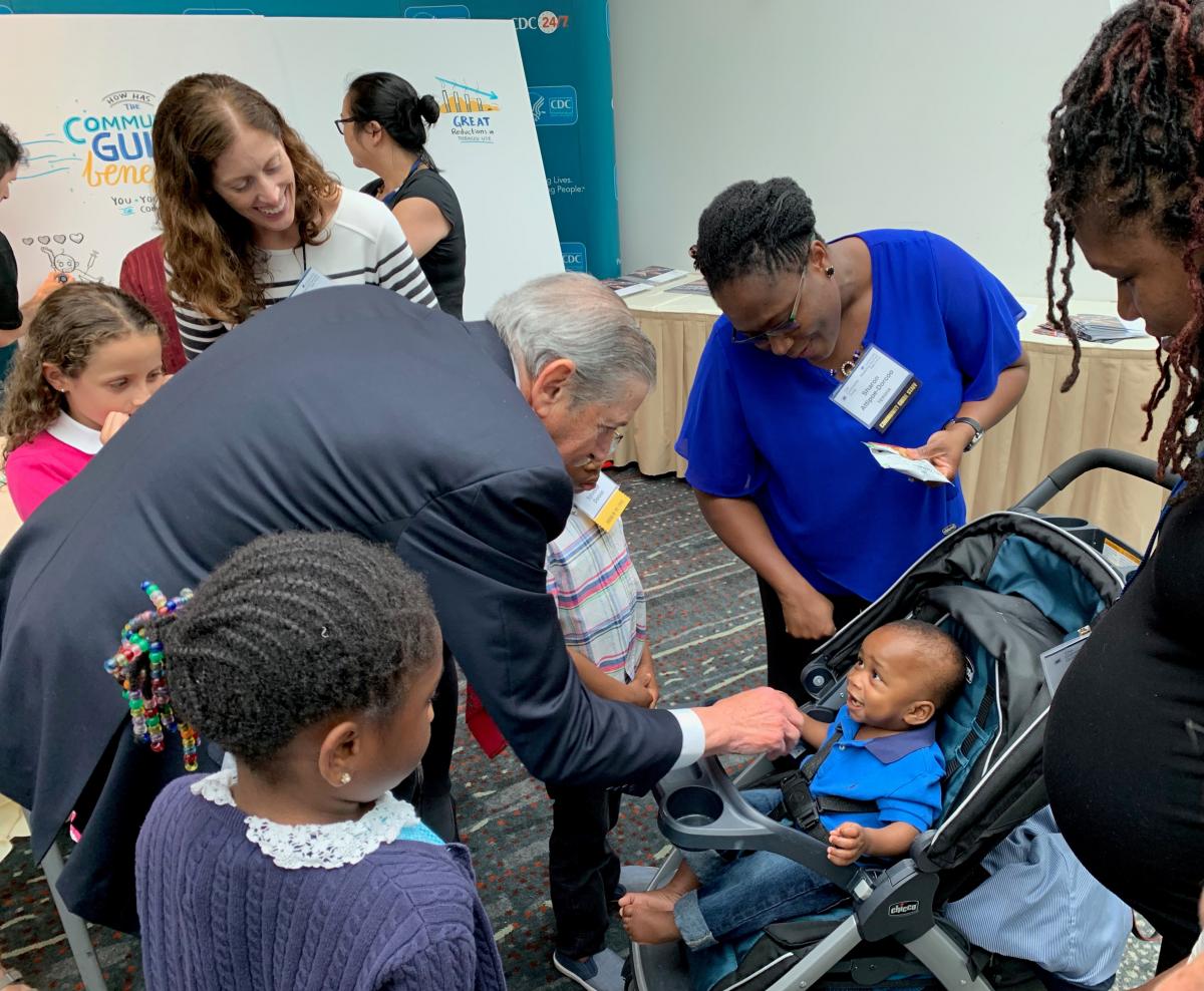 Dr. Fielding visits with Community Guide family members