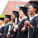 A group of high school graduates in their caps and gowns.