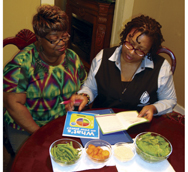 Two women looking at paperwork on healthy lifestyles.