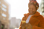 A college student looks at her mobile phone.