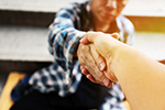 Two people shaking hands.